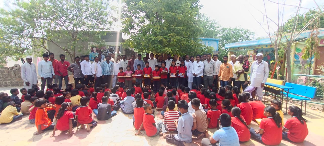 School materials to students at Aljapur school on behalf of Ashoka Foundation